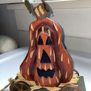 Halloween/Autumn wooden Jack O Lantern on a green wagon‎ rolling decoration